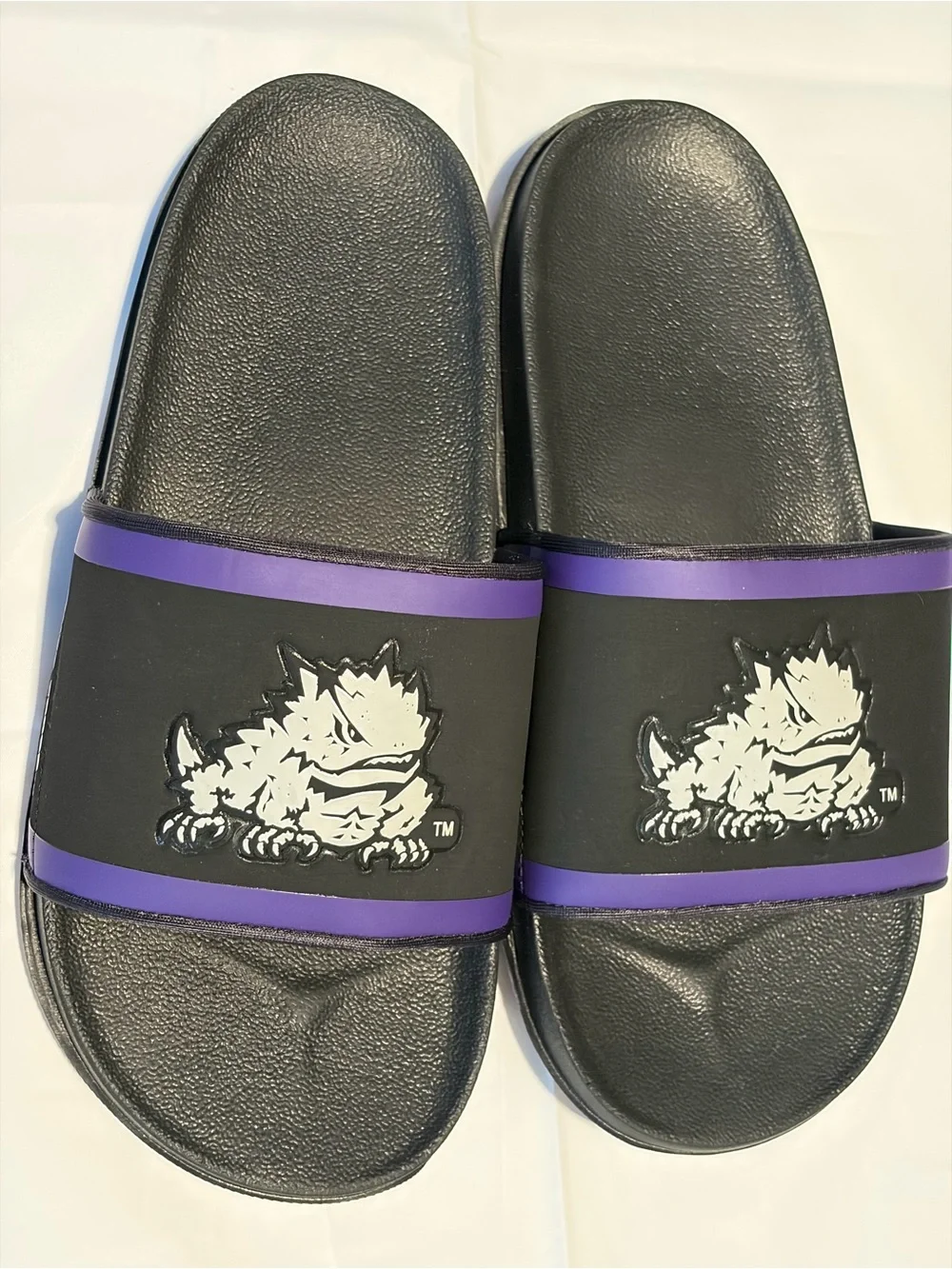 Nike Black Slide Sandals with Purple Trim and White Monster Graphic